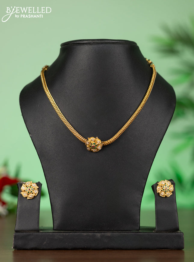 Attigai necklace with floral pendant in kemp ,white and green stones