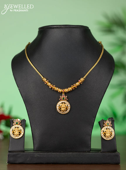 Attigai necklace with lakshmi pendant in kemp and green stones