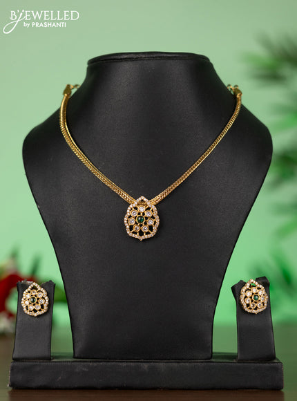 Attigai necklace with floral pendant in green stones