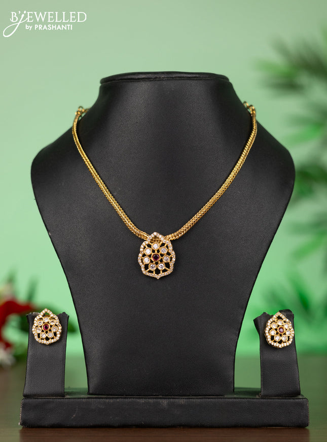 Attigai necklace with floral pendant in red stones