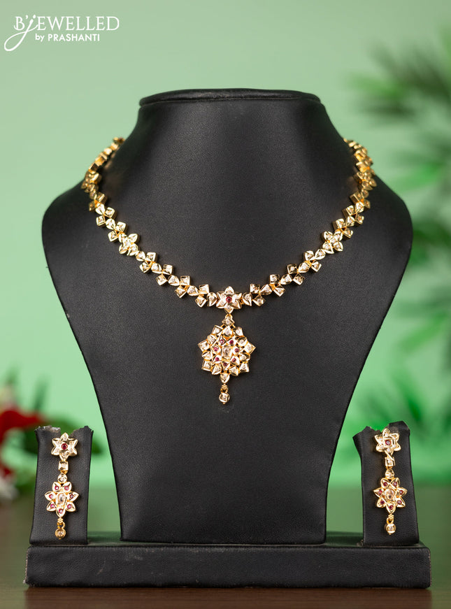 Attigai impon necklace with floral pendant in red & white stones