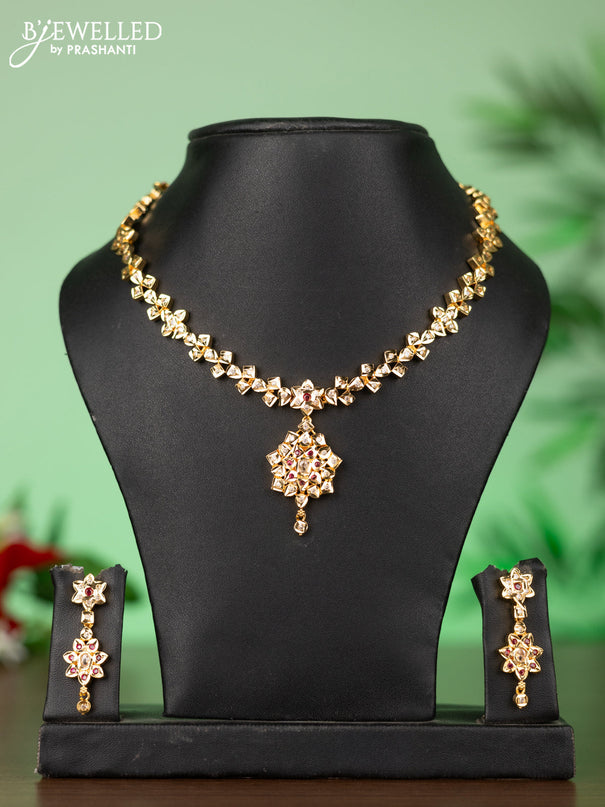 Attigai impon necklace with floral pendant in red & white stones