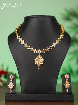 Attigai impon necklace with floral pendant in red & white stones