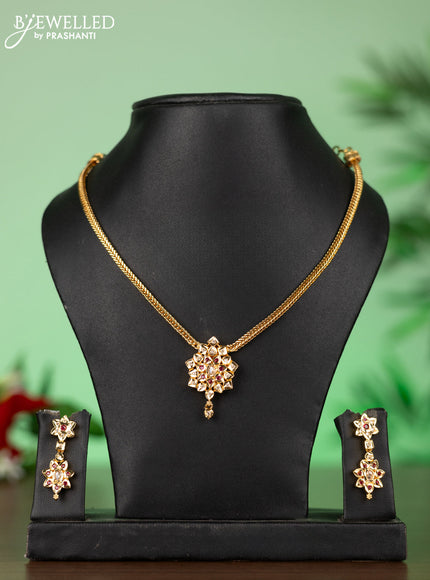 Attigai impon necklace with floral pendant in red,green and white stones