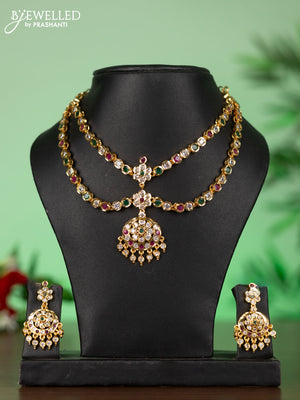 Attigai impon necklace with floral pendant in red,green and white stones