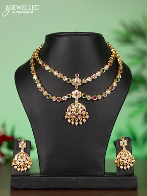 Attigai impon necklace with floral pendant in red,green and white stones