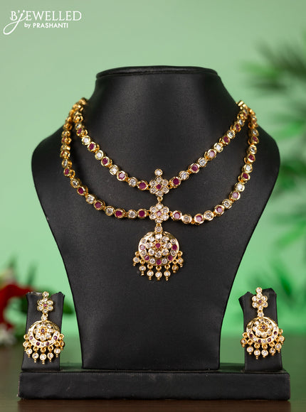 Attigai impon necklace with floral pendant in red and white stones