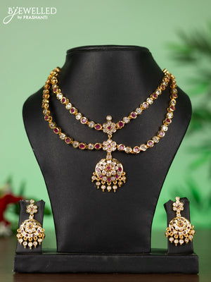 Attigai impon necklace with floral pendant in red and white stones