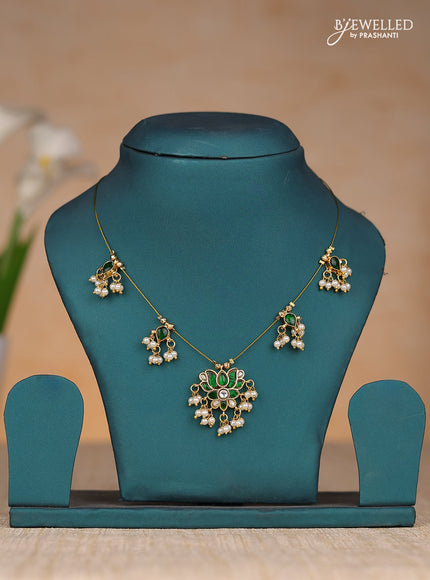 Invisble chain lotus pendant with green jadau kundan stones and pearl hangings