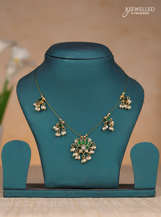 Invisble chain lotus pendant with green jadau kundan stones and pearl hangings