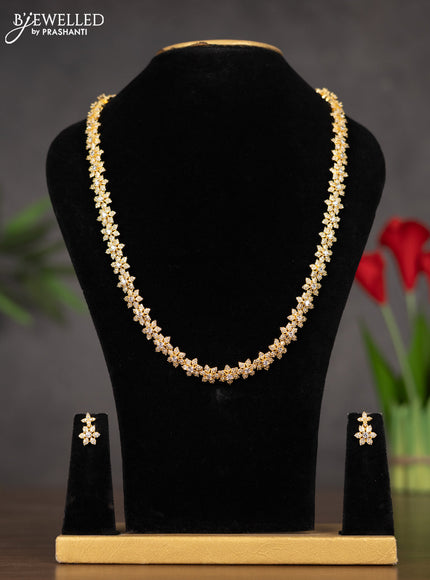 Zircon haaram with floral design white stones in gold finish