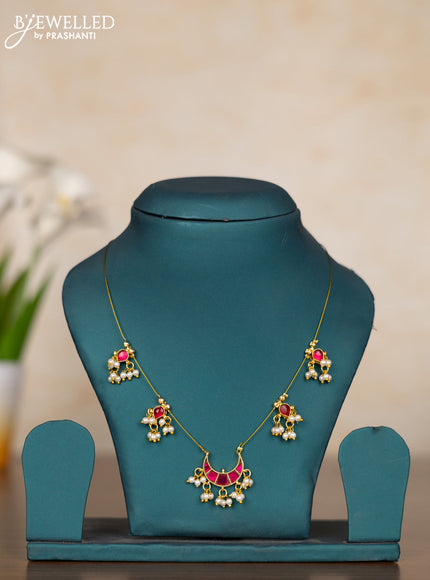 Invisible chain chandbal design with pink kemp stones and pearl hangings without earrings