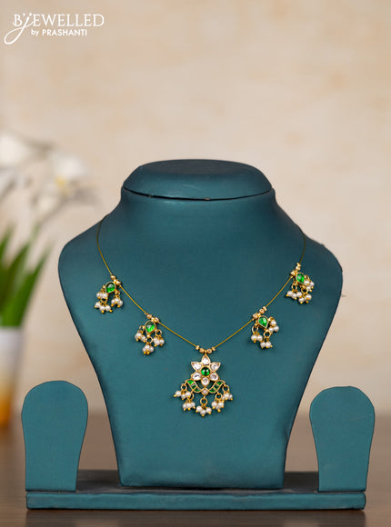 Invisible chain with floral pendant in green jadau kundan stones and pearl hanging
