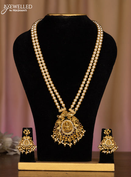 Pearl haaram with lakshmi pendant in kemp stones and golden ball hanging