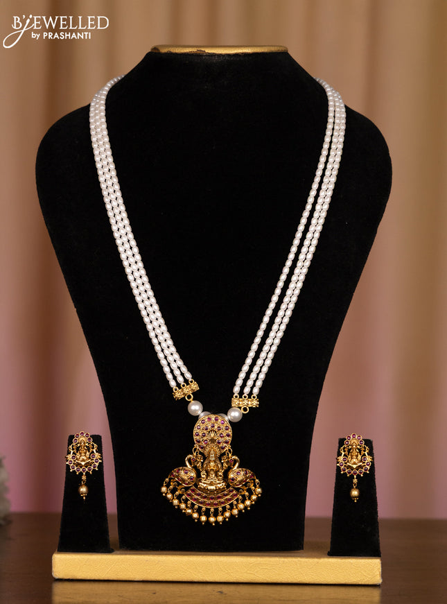 Pearl white haaram with lakshmi pendant in fully kemp stones and golden ball hanging