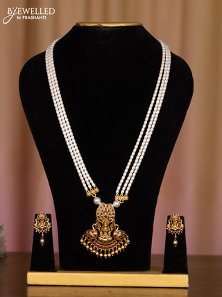 Pearl white haaram with lakshmi pendant in fully kemp stones and golden ball hanging