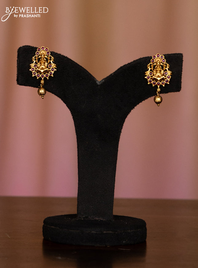 Pearl white haaram with lakshmi pendant in fully kemp stones and golden ball hanging