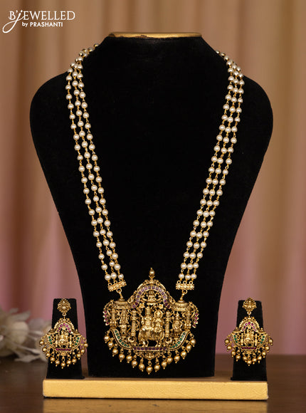 Pearl haaram with lakshmi pendant in multicolor stones and golden ball hanging