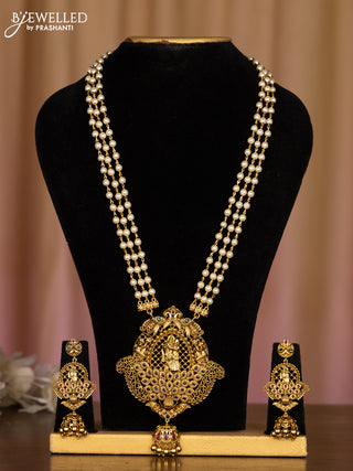 Pearl haaram with radhe krishna pendant in multicolor stones and golden ball hanging
