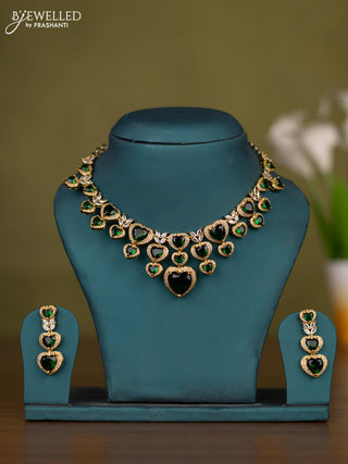 Necklace heart shape design with emerald and cz stones in victorian finish