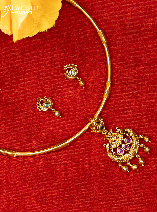 Ring type choker with small floral design in multicolor kemp stones and golden ball hanging