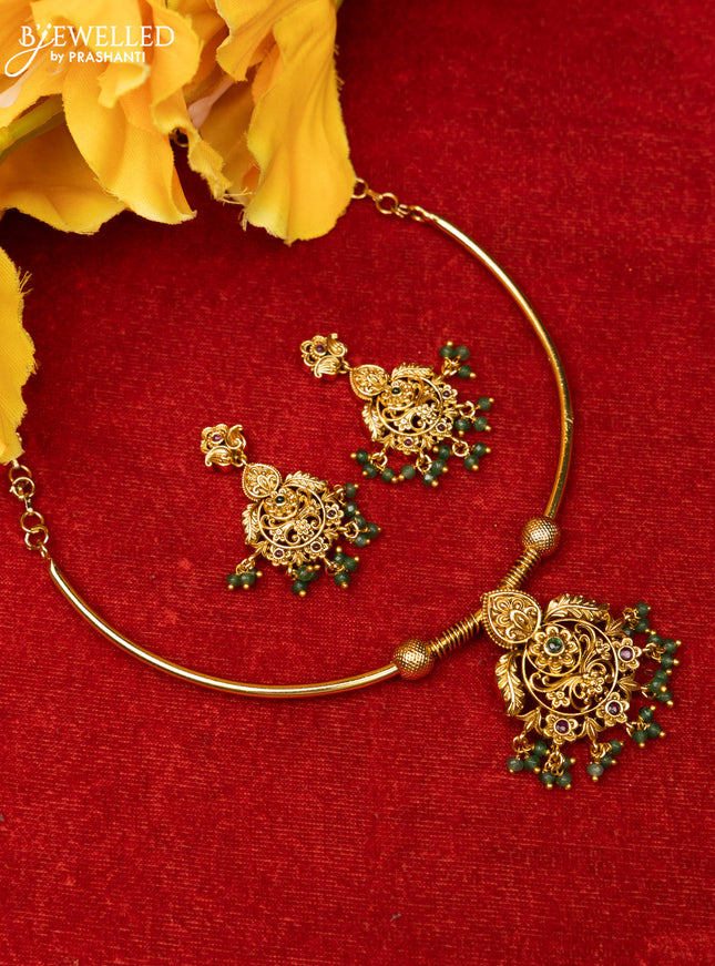 Ring type choker with floral design in red and green kemp stones and green beads hanging