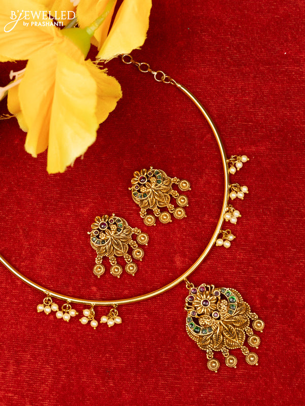 Ring type choker with floral design in red and green kemp stones and gold hanging