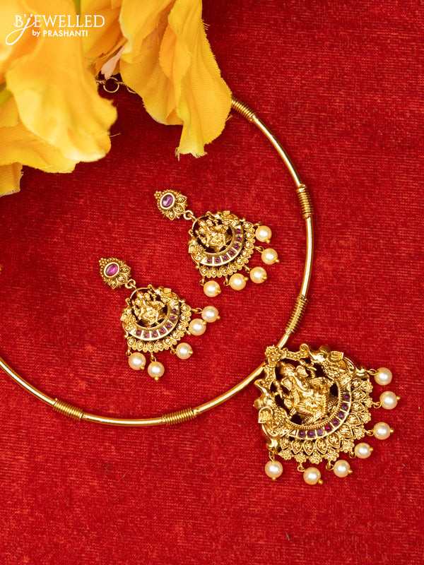 Ring type choker with ganesha design in red kemp stones and pearl hanging