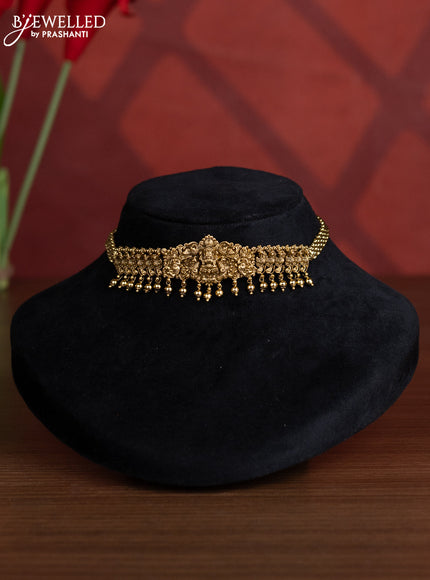 Antique choker with lakshmi design and golden beads hangings
