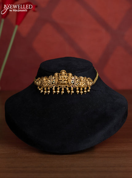 Antique choker lakshmi design with kemp stones and golden beads hangings