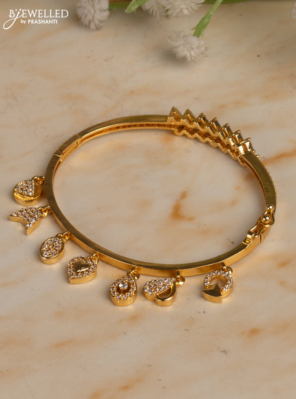 Bracelets with cz stones and hangings in gold finish