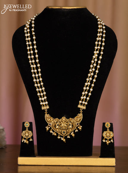 Pearl haaram ganesha pendant with kemp stones in pearl & golden beads hangings