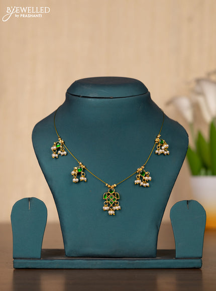 Invisible chain with green kemp jadau stones in pearl hangings without earrings