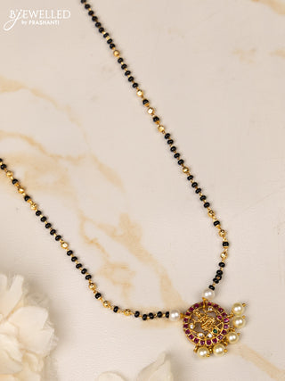 Mangalsutra with lakshmi pendant and ruby and cz stones in pearl hangings