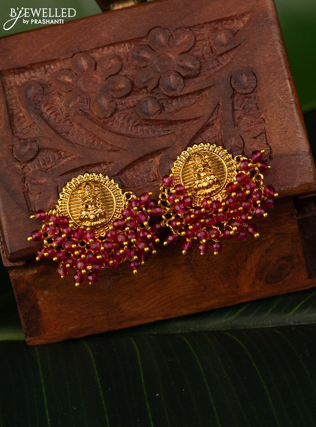 Antique earrings with lakshmi design and pink beads hanging