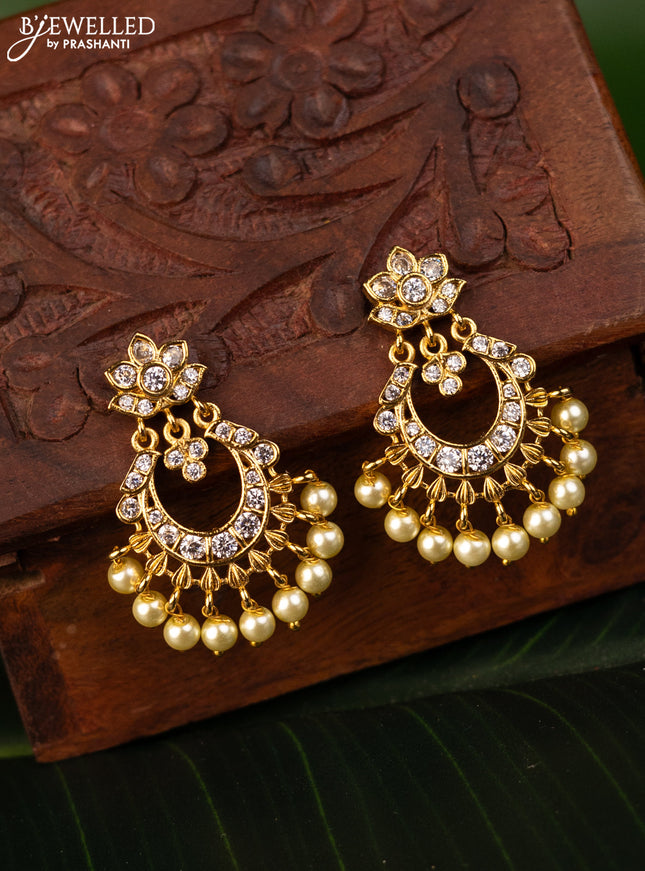 Antique earrings chandbali design with cz stones and pearl hangings