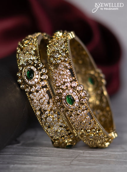 Antique bangle with green kemp and cz stones