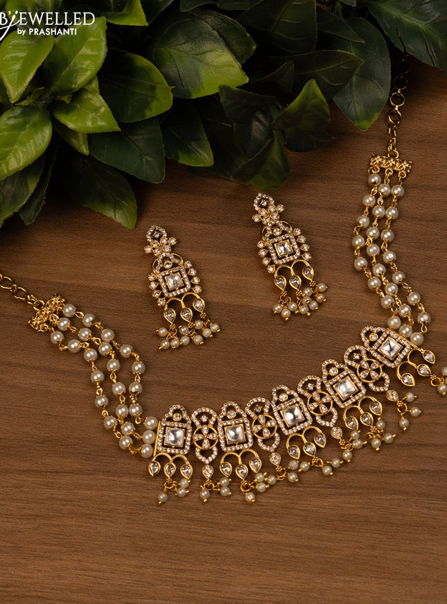 Pearl choker with kundan & cz stones and pearl hangings