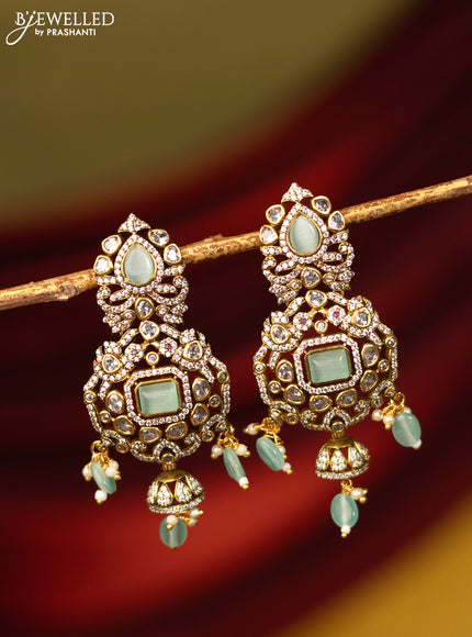 Earrings with mint green & cz stones and beads hanging in victorian finish