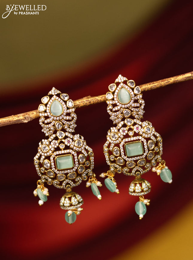 Earrings with mint green & cz stones and beads hanging in victorian finish