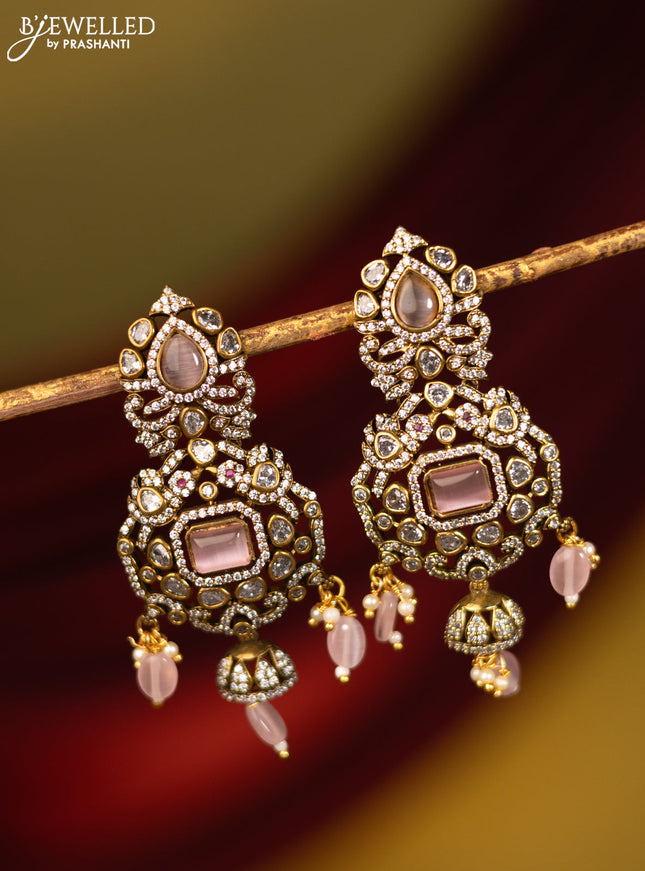Earrings with baby pink & cz stones and beads hanging in victorian finish