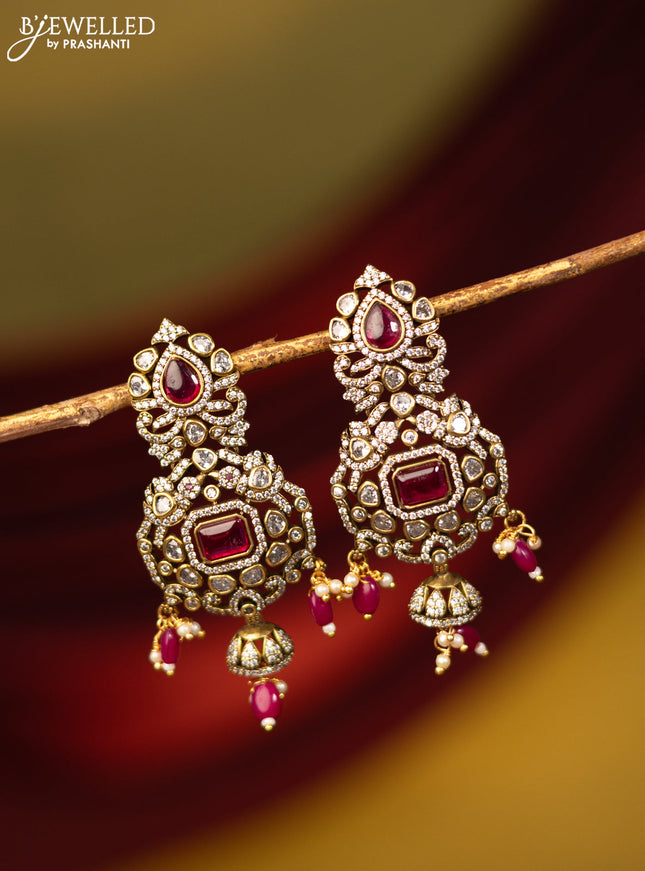 Earrings with ruby & cz stones and beads hanging in victorian finish