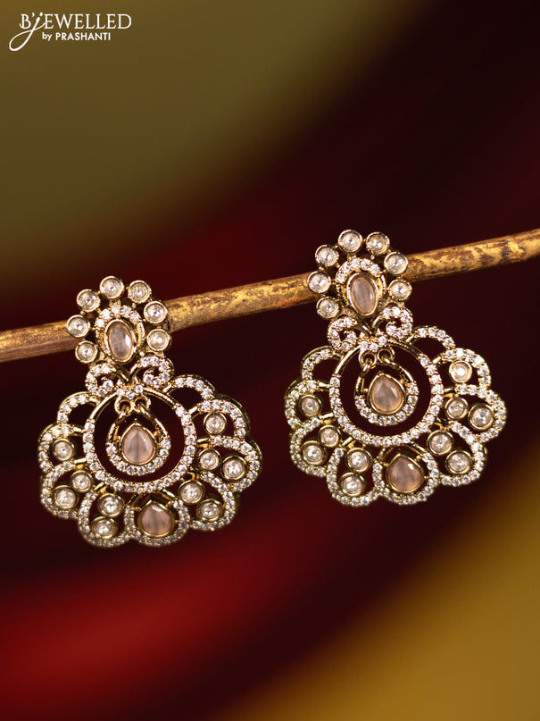 Earrings with baby pink and cz stones in victorian finish