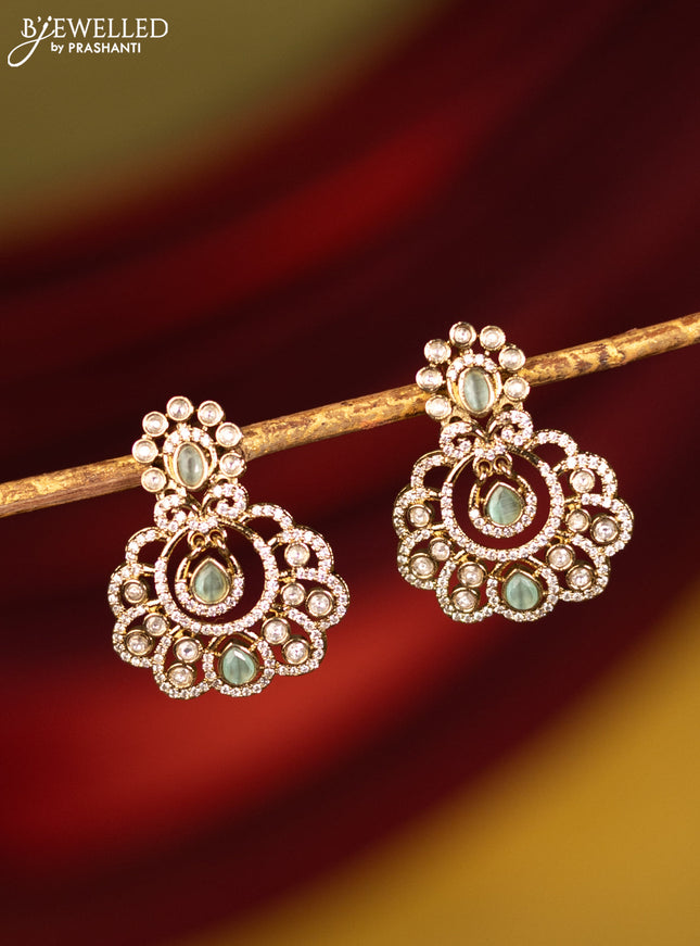 Earrings with mint green and cz stones in victorian finish