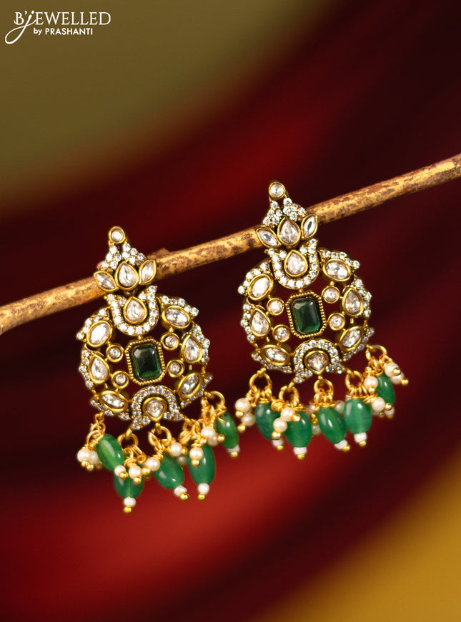 Earrings with emerald & cz stones and beads hanging in victorian finish