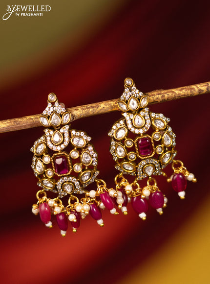 Earrings with ruby & cz stones and beads hanging in victorian finish