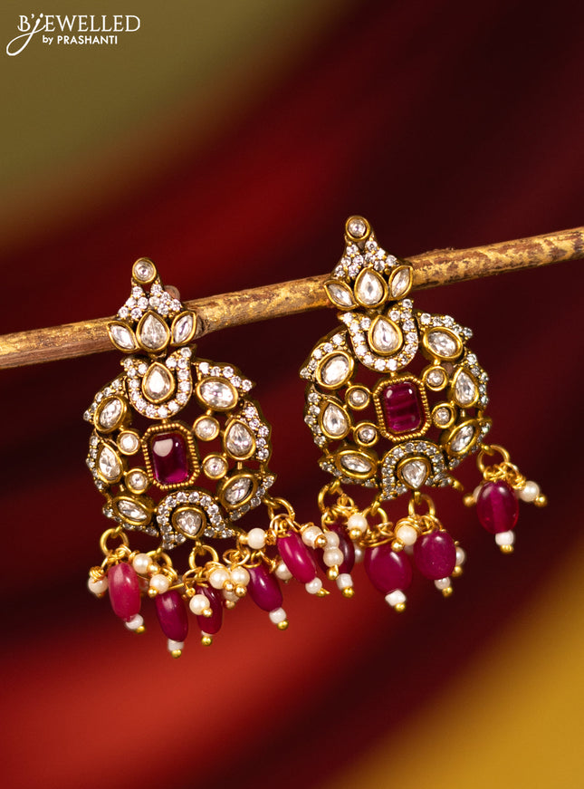 Earrings with ruby & cz stones and beads hanging in victorian finish