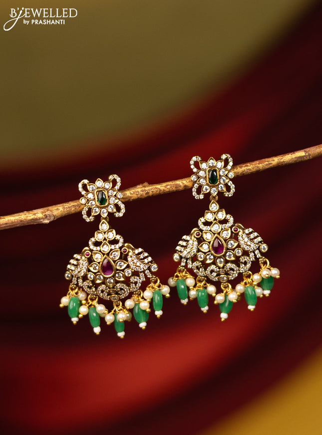Earrings with kemp & cz stones and beads hanging in victorian finish