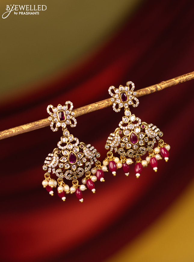 Earrings with ruby & cz stones and beads hanging in victorian finish