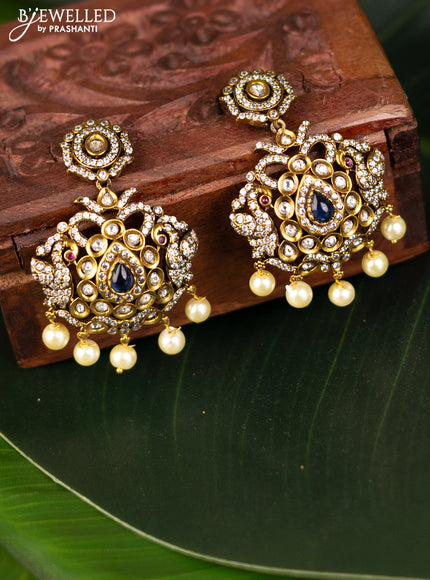 Earrings with sapphire & cz stones and pearl hangings in victorian finish